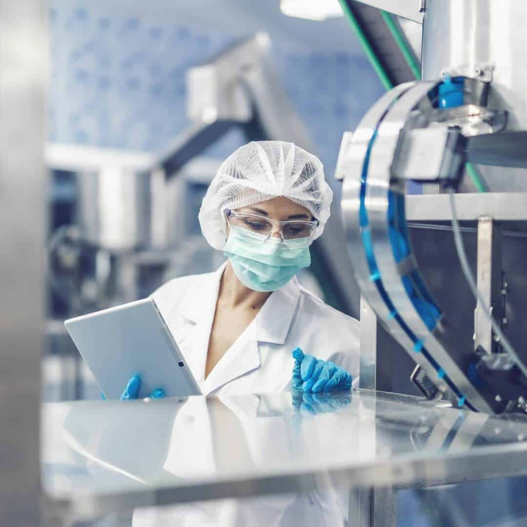 A scientist checking factory equipment