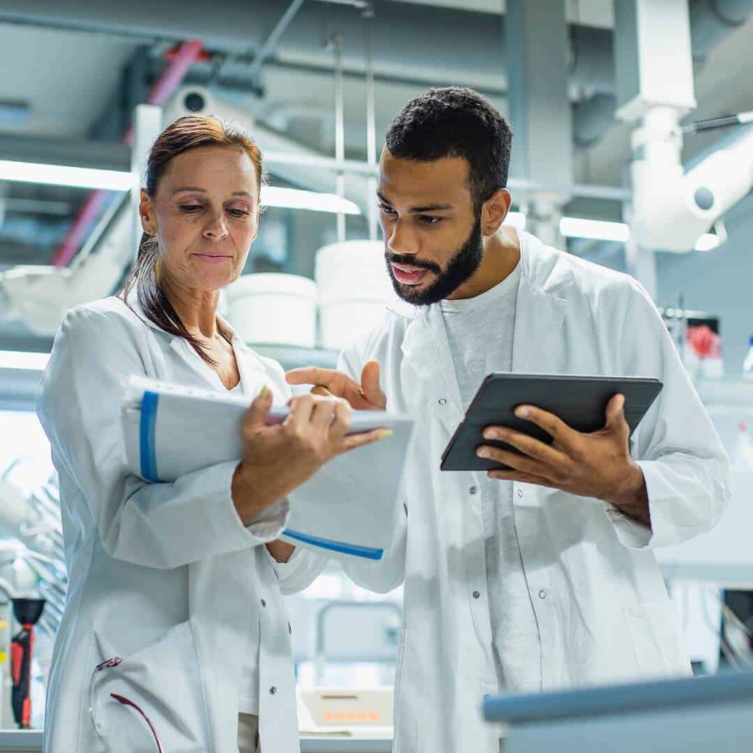 Scientists discussing lab research