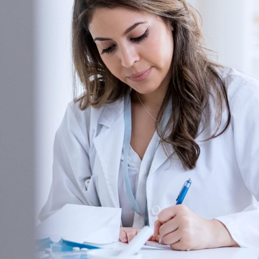 Woman writing lab test results