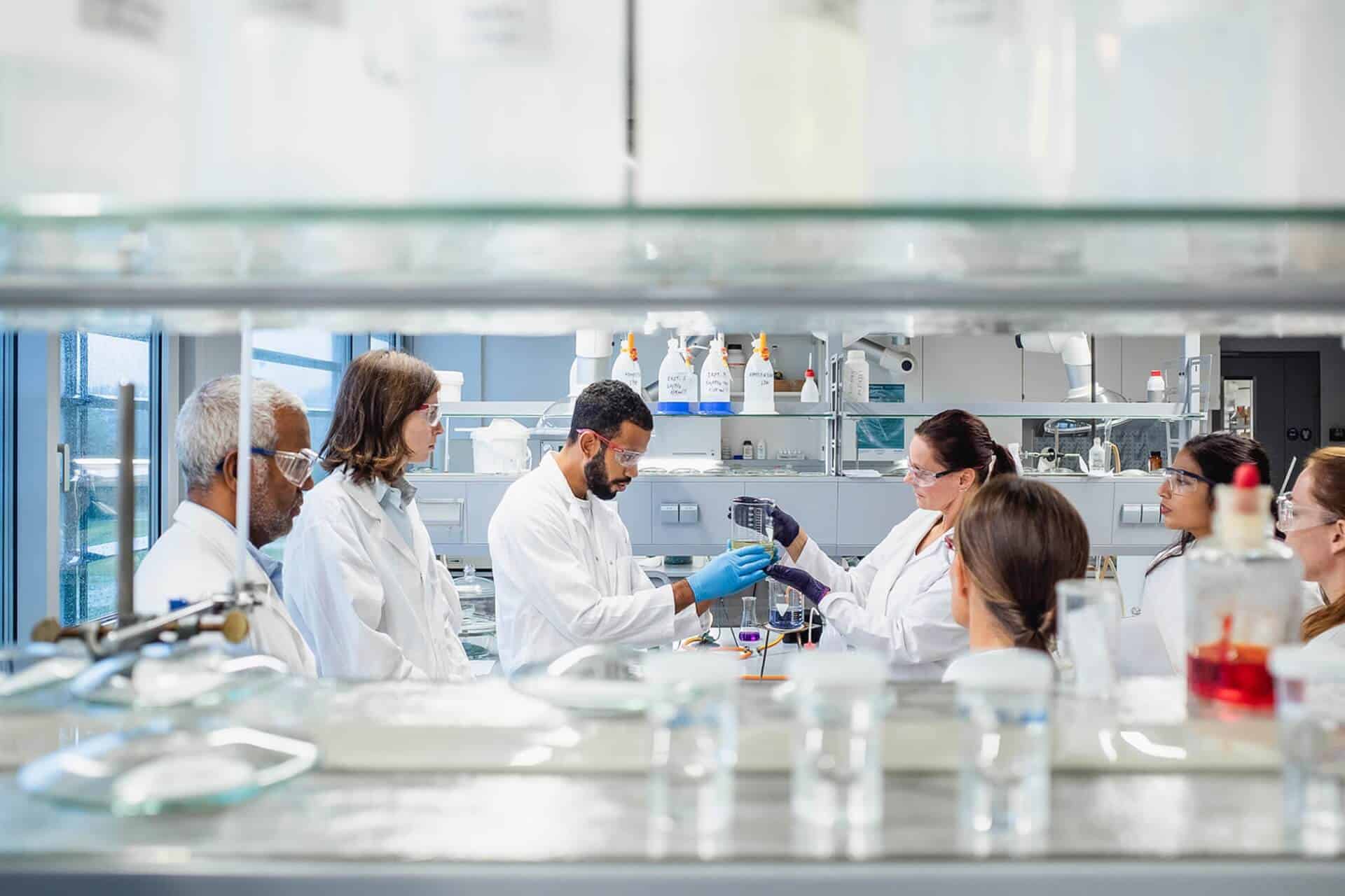 Scientists collaborating in laboratory
