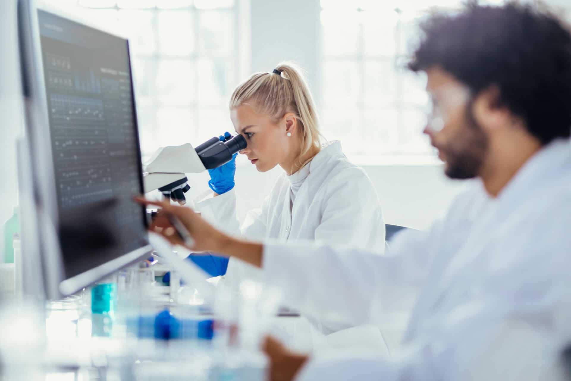 Scientists analyzing lab data