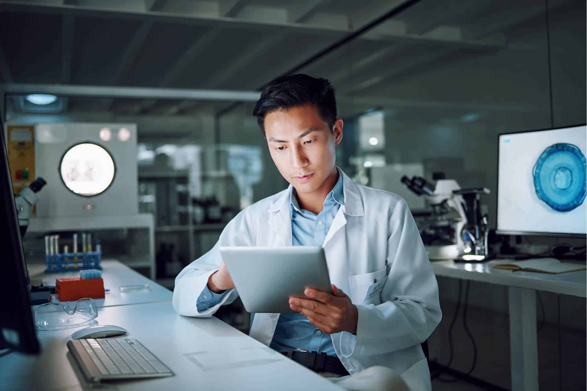 Scientist reviewing data on tablet
